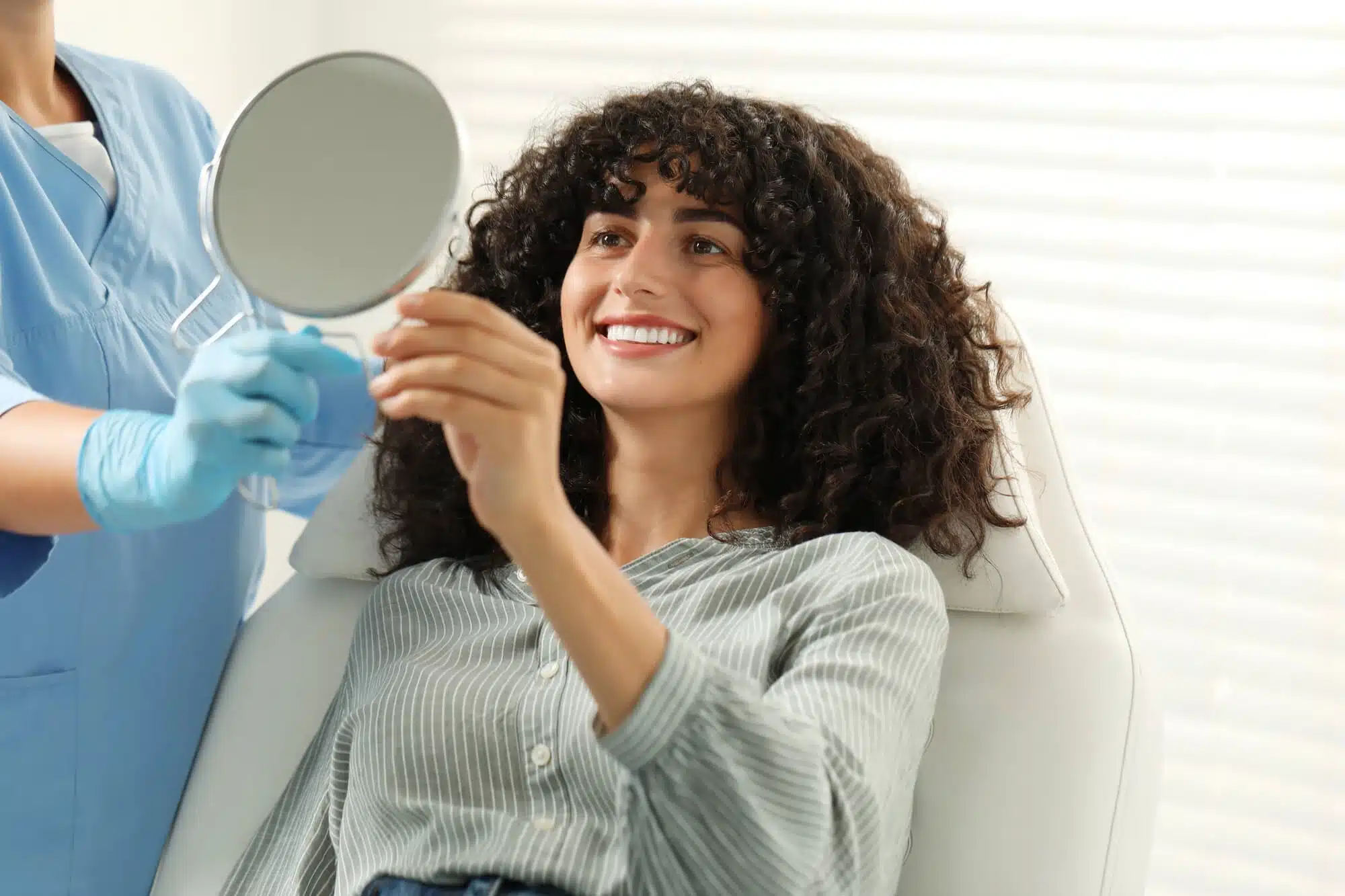 Patient Viewing Results of Veneers in Riverview, MI