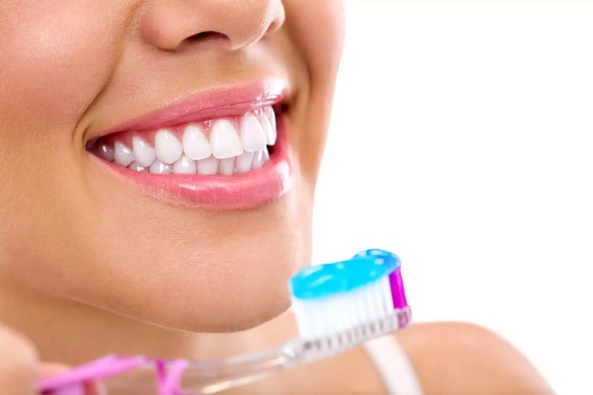 Perfect smile and a toothbrush in dentist near Wyandotte, Mi