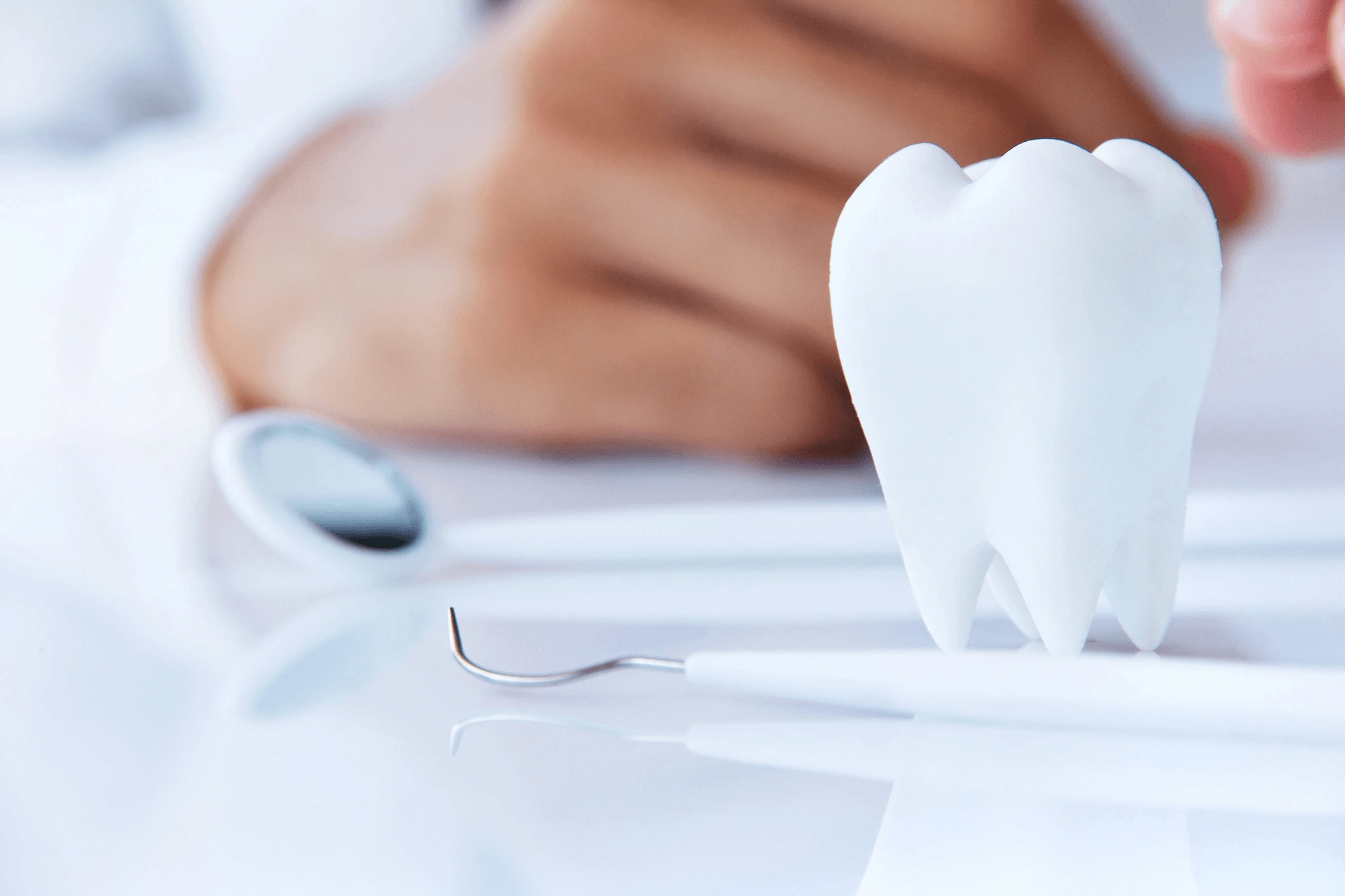 Dentist performing tooth extractions in Riverview, MI